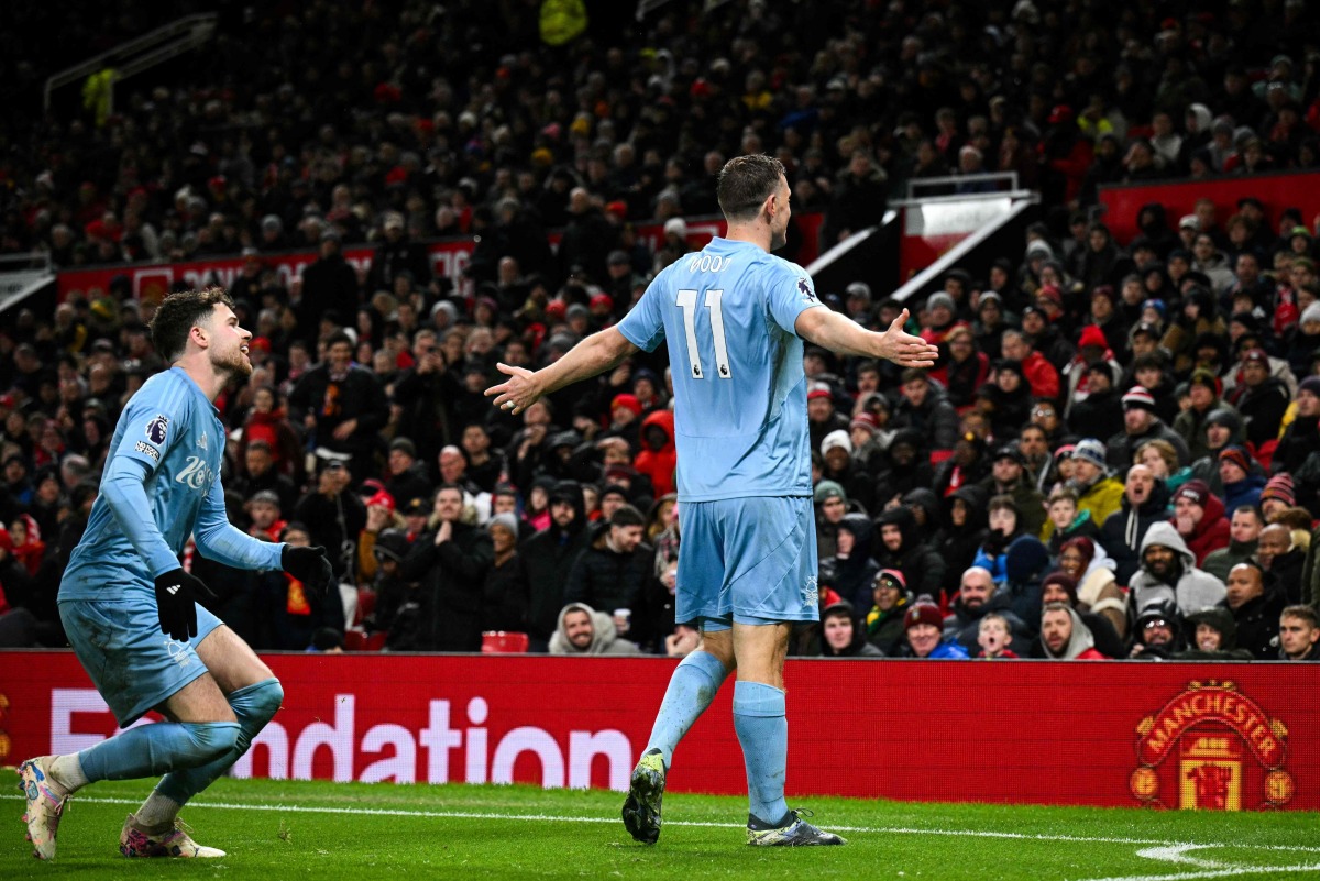 Nottingham Forest's New Zealand striker #11 Chris Wood celebrates after scoring his team third goal during the English Premier League football match between Manchester United and Nottingham Forest at Old Trafford in Manchester, north west England, on December 7, 2024. (Photo by Oli SCARFF / AFP)
