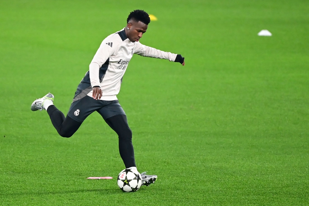 Real Madrid's Brazilian forward #7 Vinicius Junior attends a training session on the eve of the UEFA Champions League football match Atalanta vs Real Madrid in Bergamo, Italy on December 9, 2024 (Photo by Piero Cruciatti / AFP)
