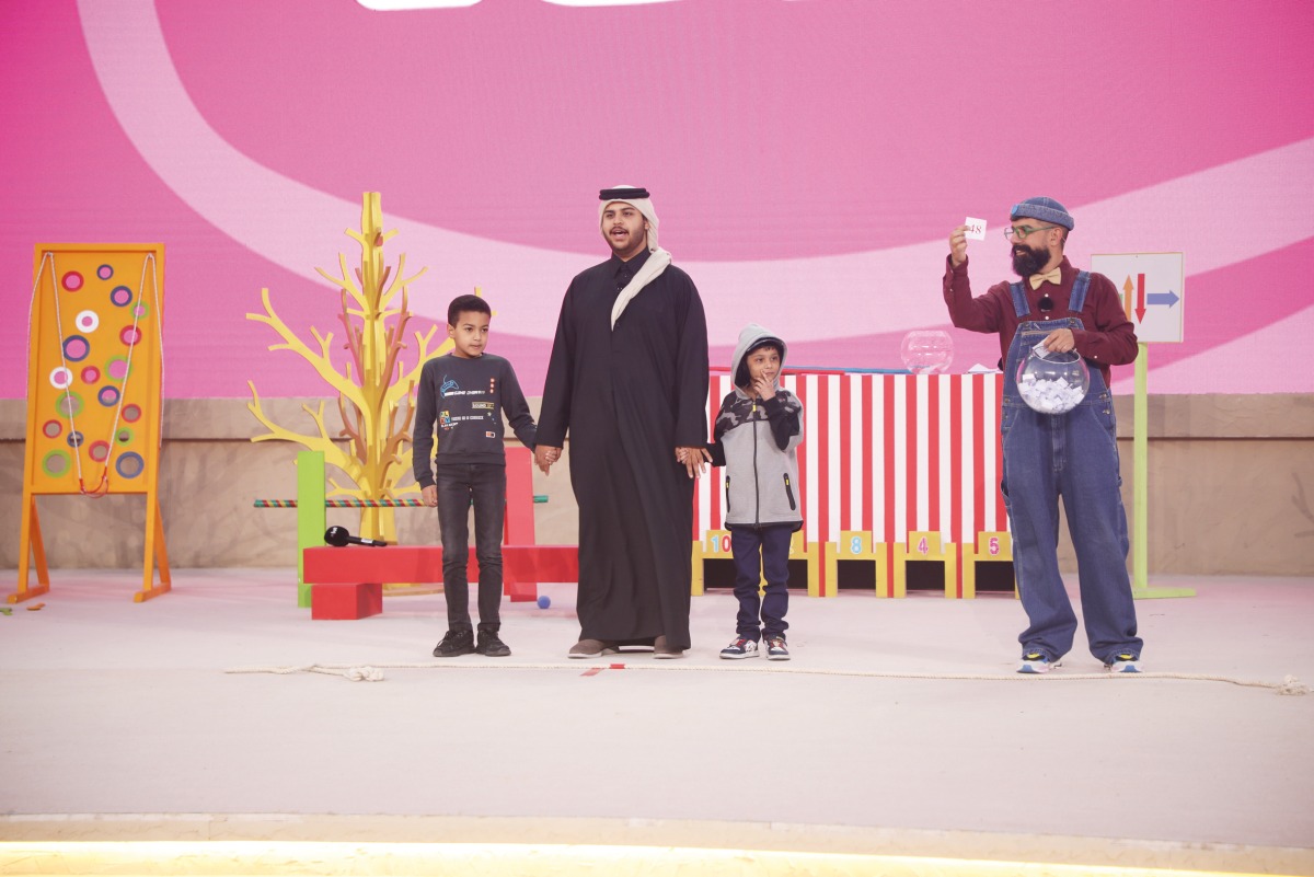 Children participate in the programme held as part of National Day activities at Dar Al Saai.