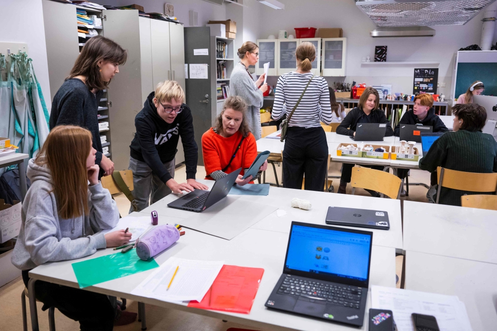 Students attend a class on media literacy at the Hiidenkiven Koulu school on November 19, 2024 in Helsinki, Finland. (Photo by Jonathan Nackstrand / AFP)