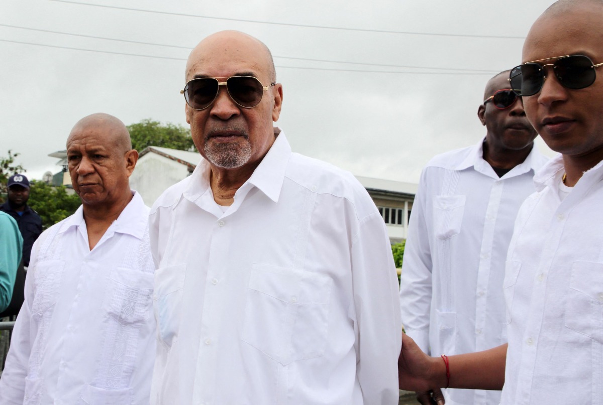 (FILES) Suriname former President Desi Bouterse (C) leaves the High Court of Justice after his appeal case against the Court Martial sentence of 20-year jail for his involvement in the murder of 15 people when he ruled in 1982 during his military government, in Paramaribo on January 5, 2023. (Photo by Ranu Abhelakh / AFP)
