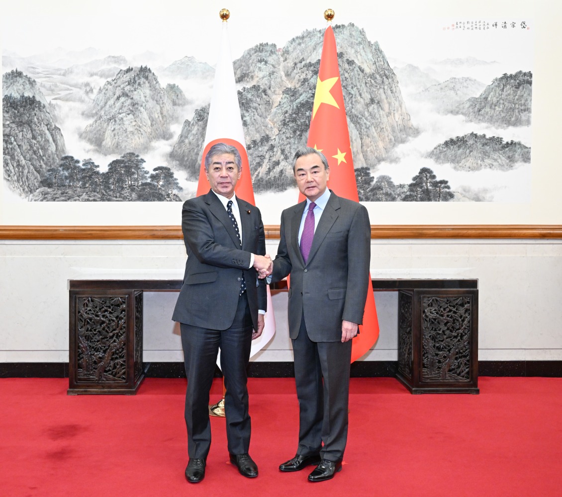Chinese Foreign Minister Wang Yi, also a member of the Political Bureau of the Communist Party of China Central Committee, holds talks with Japanese Minister for Foreign Affairs Takeshi Iwaya in Beijing, capital of China, Dec. 25, 2024. (Xinhua/Li Xiang)

