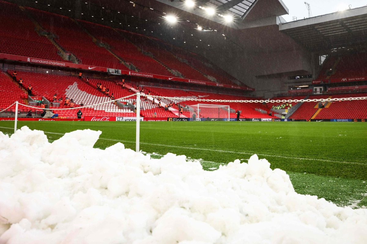 A photograph taken on January 5, 2025 shows pile of snows on the side of the pitch prior to the English Premier League football match between Liverpool and Manchester United at Anfield in Liverpool, north west England. (Photo by Darren Staples / AFP) 