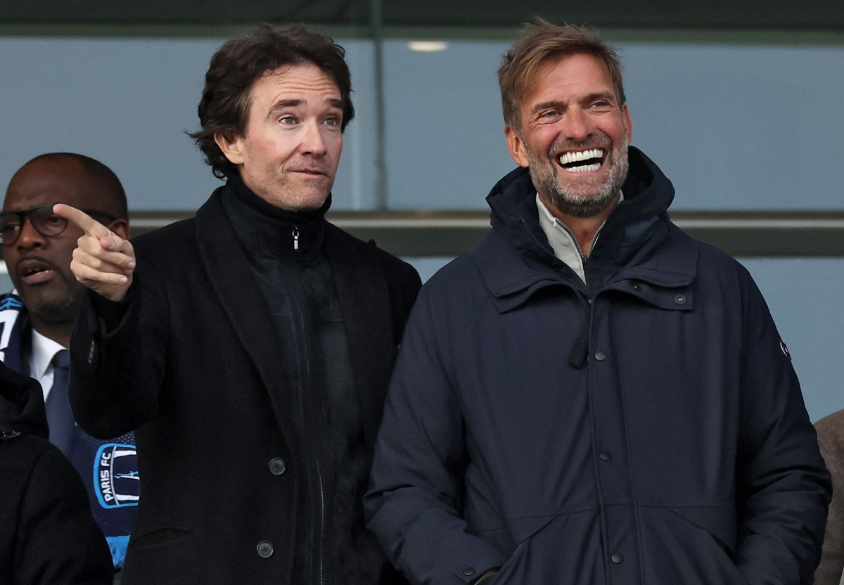 German football trainer and global head of Football at Red Bull, Jurgen Klopp (R) and representative of the Agache family holding company Antoine Arnault are seen prior to the French Ligue 2 football match between Paris football Club (PFC) and Amiens at Stade Charley in Paris, on January 11, 2025. Photo by FRANCK FIFE / AFP