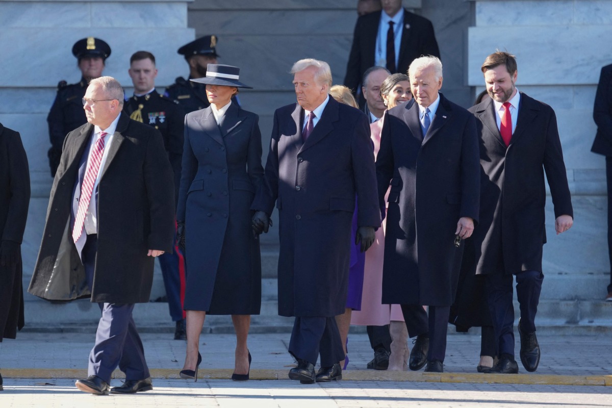 US President Donald Trump, First Lady Melania Trump, outgoing US President Joe Biden and first lady Dr. Jill Biden participate in the departure ceremony for the Bidens on the East Front of the United States Capitol in Washington, DC after the swearing-in of Donald Trump as President on January 20, 2025. (Photo by Chris KLEPONIS / POOL / AFP)
