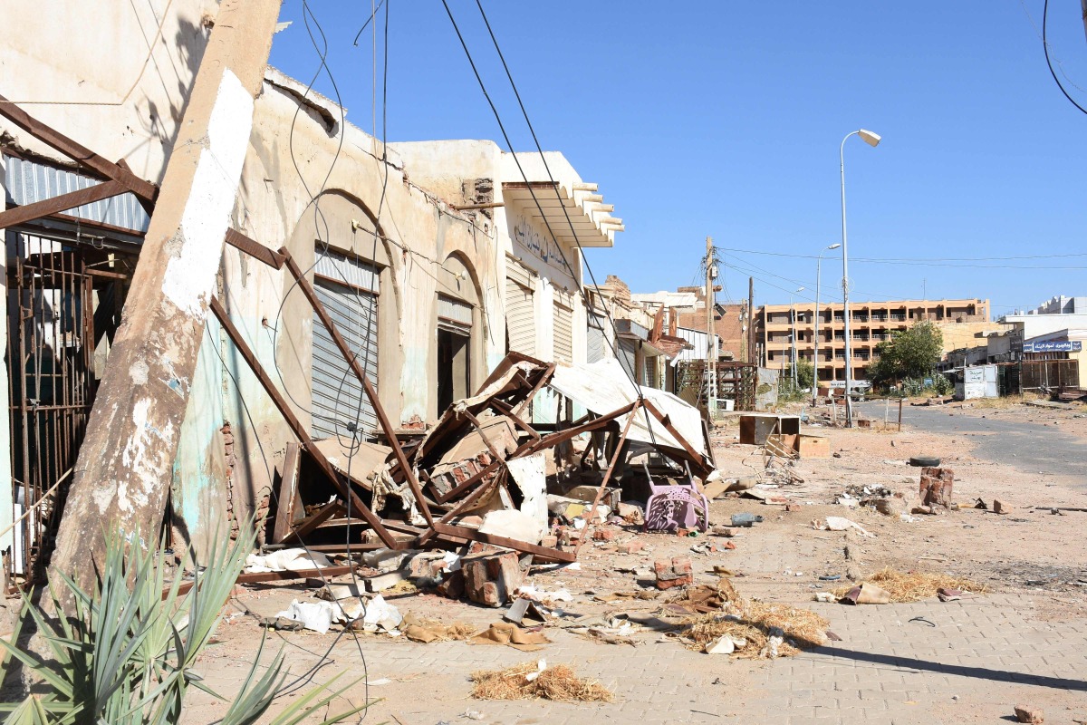 A picture taken on January 19, 2025 shows a general view of damaged shops and houses in Sudan's Al-Jazira state capital Wad Madani following its takeover by the army from paramilitary Rapid Support Forces (RSF). (Photo by AFP)
