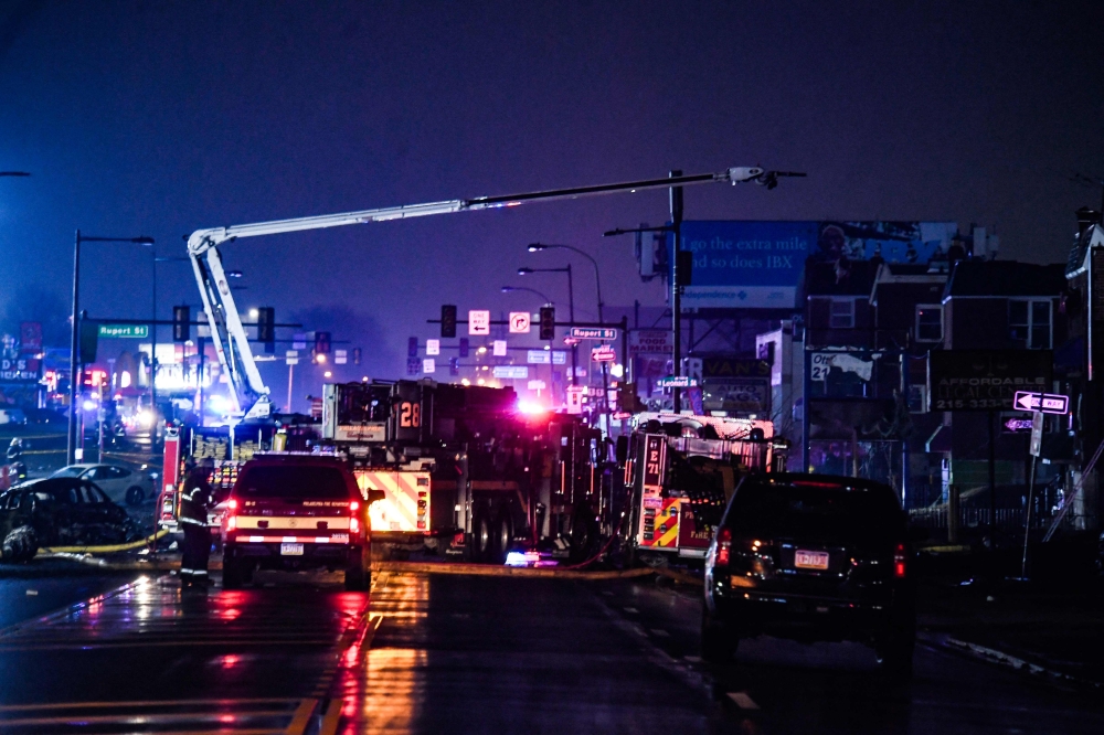 Emergency service members respond to a plane crash in a neighborhood near Cottman Avenue on January 31, 2025 in Philadelphia, Pennsylvania. Matthew Hatcher/Getty Images/AFP 