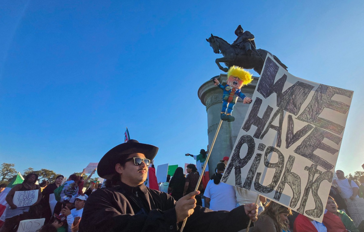 People gather in support of immigrants in Houston, Texas, on February 2, 2025. (Photo by Moisés ءVILA / AFP)

