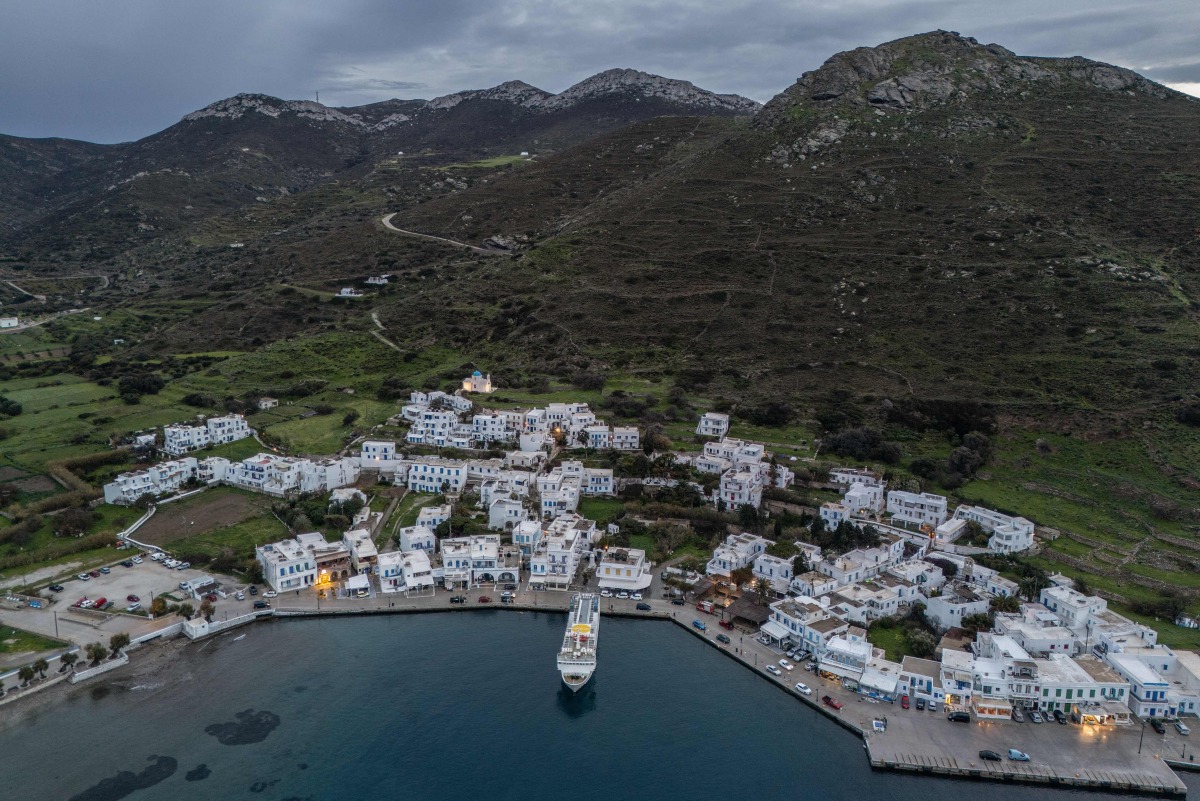 An aerial view shows the port of Katapola, on the Greek island of Amorgos, in the Aegean Sea, on February 14, 2025. Photo by Angelos TZORTZINIS / AFP