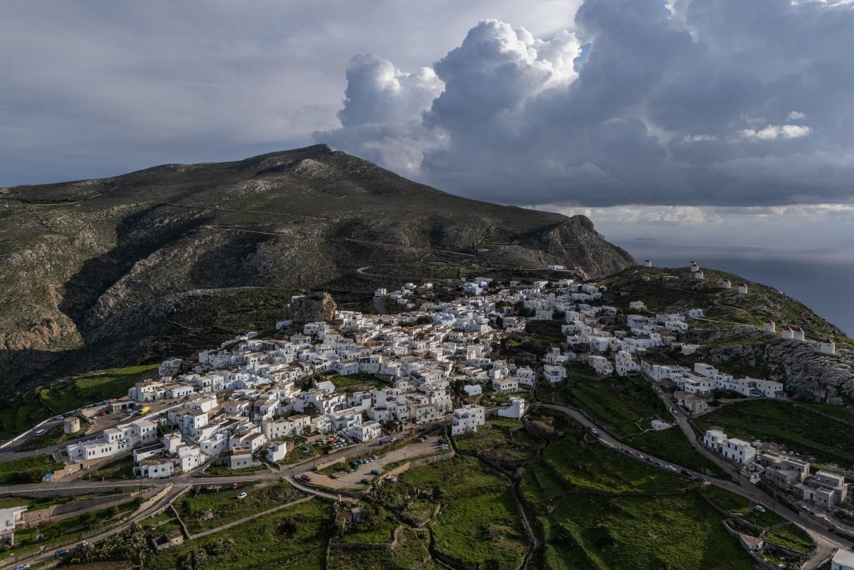 An aerial view shows the main town of Amorgos, on the Greek island of Amorgos, in the Aegean Sea, on February 15, 2025. (Photo by Angelos Tzortzinis / AFP)
