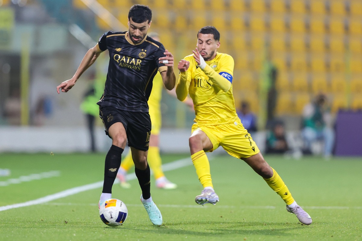Al Sadd’s Boualem Khoukhi (left) in action against Al Wasl’s Ali Saleh during the match.