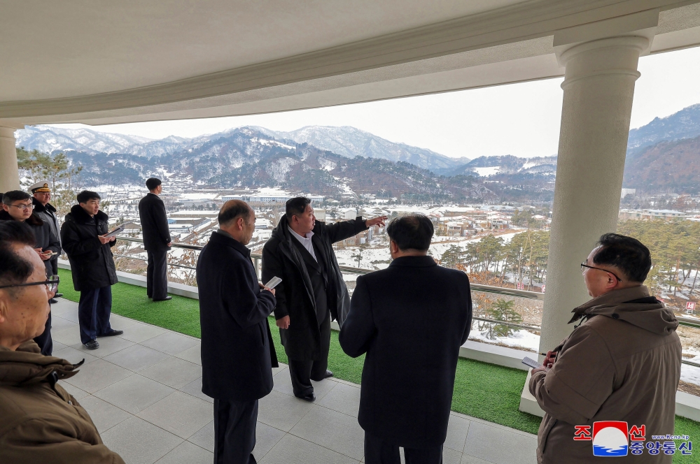 This undated picture released from North Korea's official Korean Central News Agency (KCNA) via KNS on March 8, 2025 shows North Korean leader Kim Jong Un (C) inspecting a development project at the Onpho Kulloja (working people) Holiday Camp in North Hamgyong Province of North Korea. (Photo by KCNA VIA KNS / AFP)