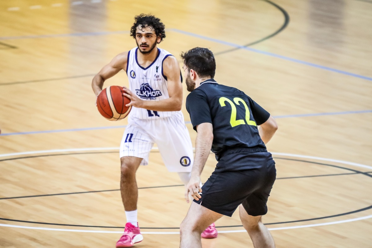 Al Khor's Youssef A Y Yagoub (left) prepares to make a pass.