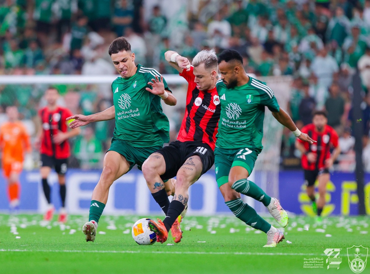 Al Rayyan's Roger Guedes (centre) is challenged by two Al Ahli Saudi FC players. PIC: Al Ahli Saudi FC