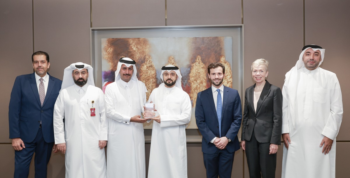 Officials pose for a group photo during the meeting.