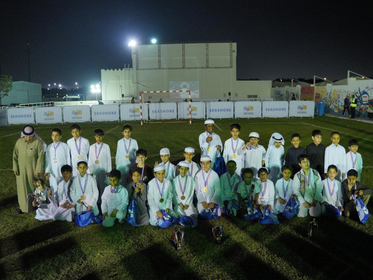 Children taking part in QM Kids Ramadan Football Tournament with their medals. 