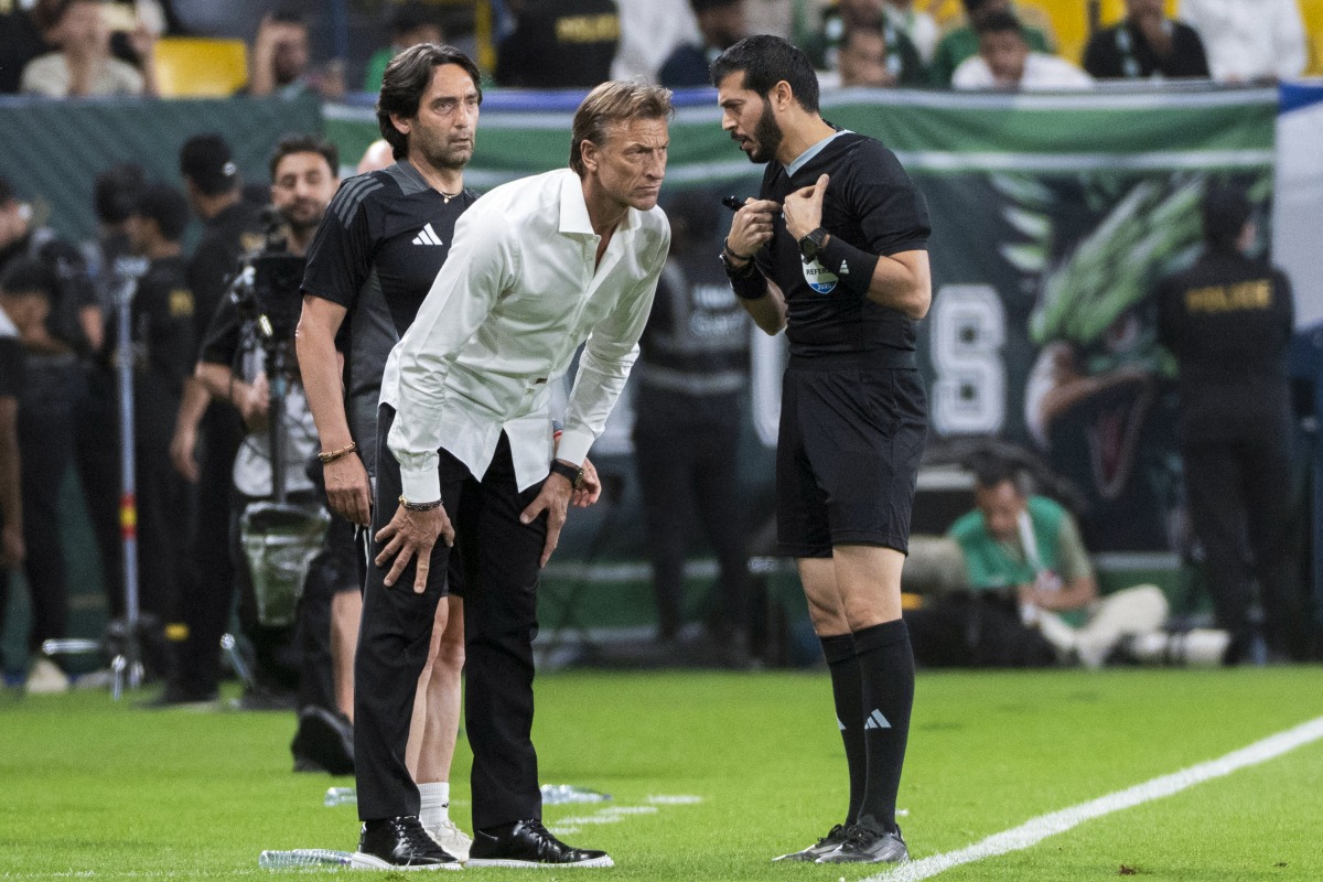 Saudi Arabia's French coach Herve Renard speaks with the referee during the FIFA World Cup 2026 Asia zone qualifiers group C football match between Saudi Arabia and China at the Al-Awwal Park in Riyadh on March 20, 2025. (Photo by AFP)
