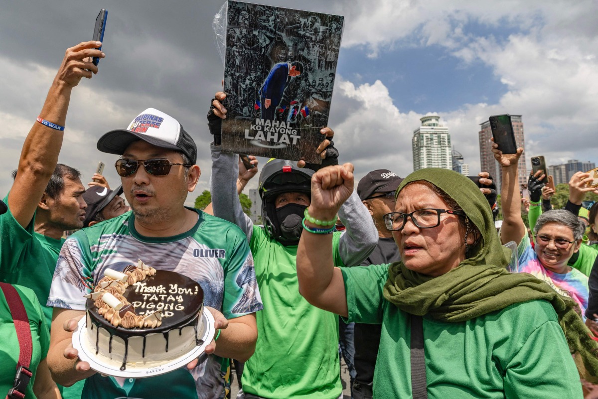 Supporters of former Philippine president Rodrigo Duterte take part in a motorcade rally to celebrate his 80th birthday at Quirino Grandstand in Manila on March 28, 2025. Photo by Earvin Perias / AFP