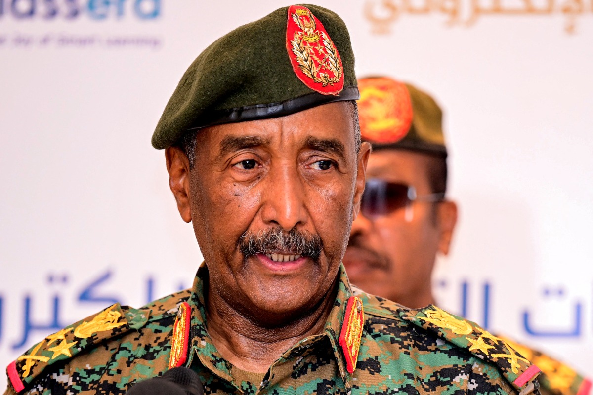 (FILES) Sudan's army chief General Abdel Fattah Al-Burhan addresses the conference to support initiatives for e-learning projects and the enrichment of education infrastructure in the Darfur region and the launch of smart education platforms, in Port Sudan on February 17, 2025. (Photo by AFP)