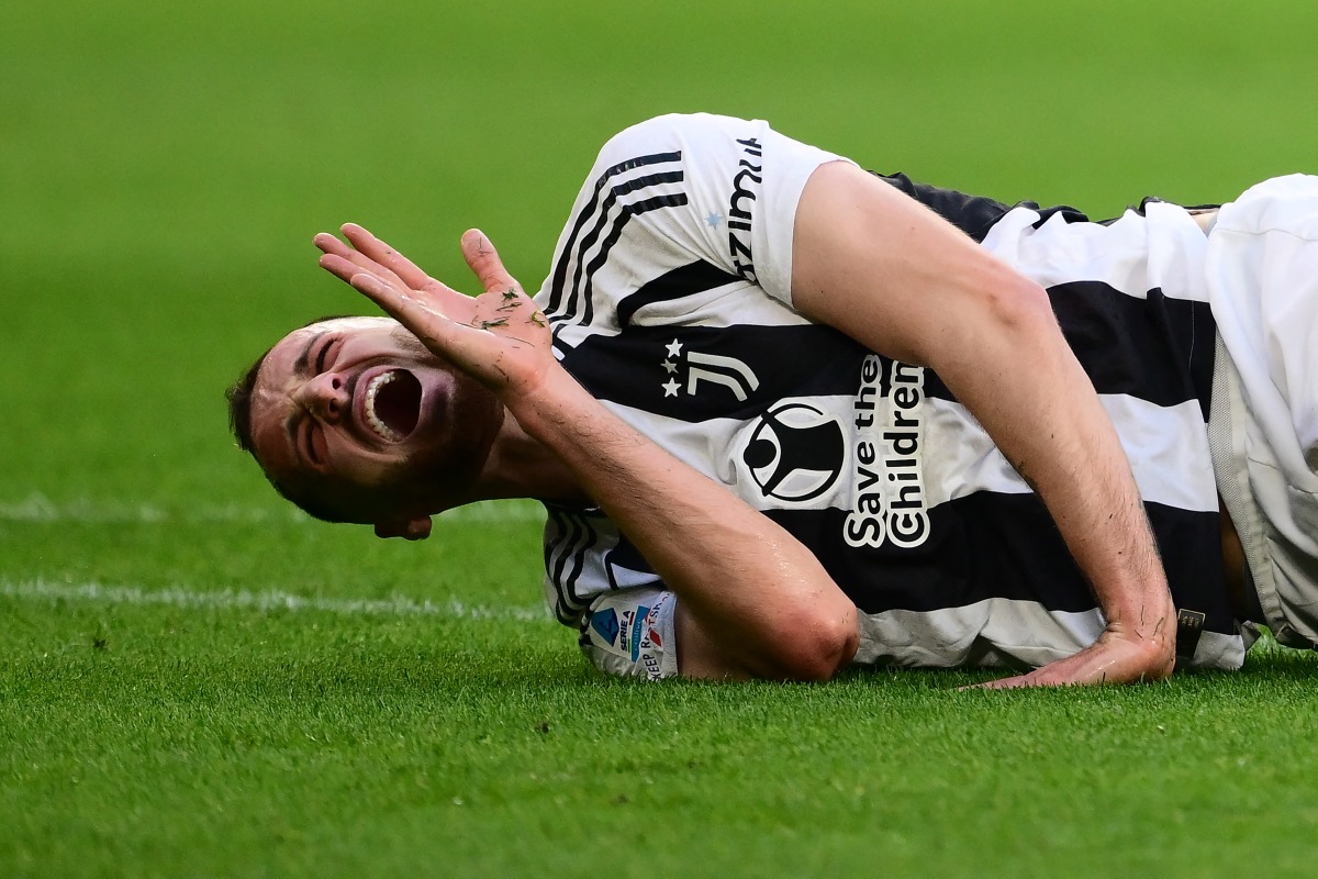 Juventus' Italian defender #04 Federico Gatti grimaces during the Italian Serie A football match between Juventus and Genoa at the Allianz Stadium in Turin, on March 29, 2025. (Photo by MARCO BERTORELLO / AFP)
