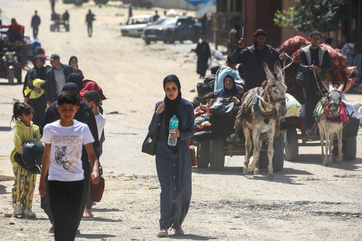 People fleeing Rafah arrive in Khan Yunis city following new Israeli evacuation orders, in the southern Gaza Strip, on March 31, 2025. Photo by Eyad BABA / AFP