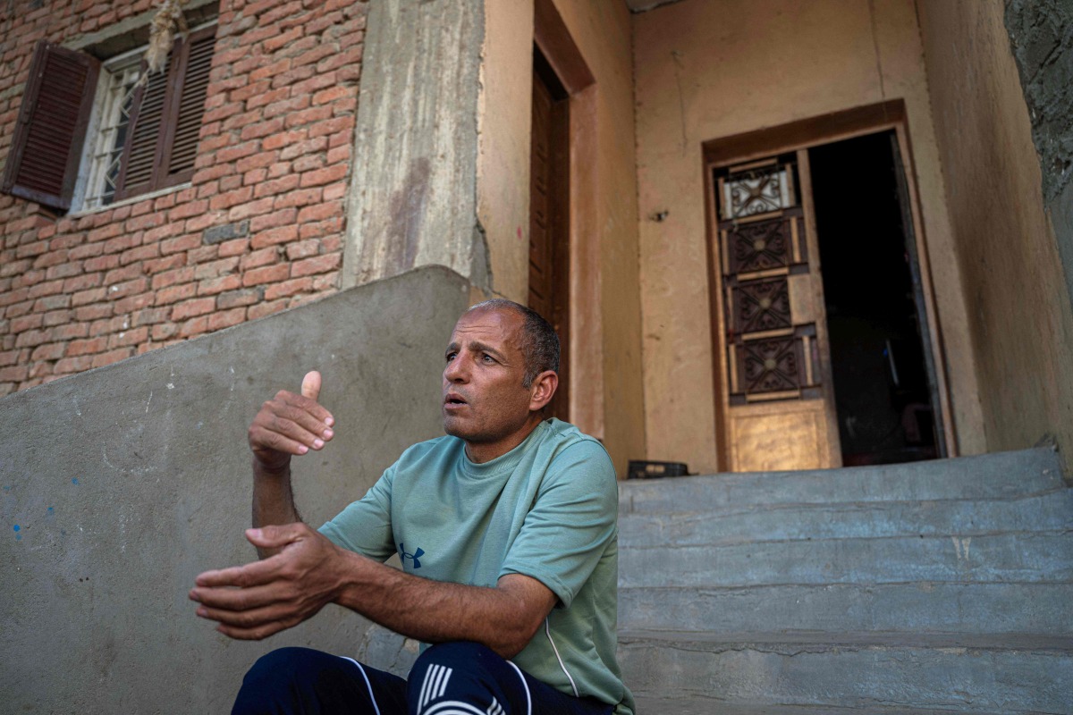 Egyptian Mohamed Shaaban, 43, talks during an interview at home in Abu shanab village in Fayyoum governorate, about 101Km southwest of Cairo on March 25, 2025, after he was freed with two compatriots from RSF captivity in war-torn Sudan in a joint operation by Egyptian and Sudanese security forces earlier in the month. (Photo by Khaled DESOUKI / AFP)
