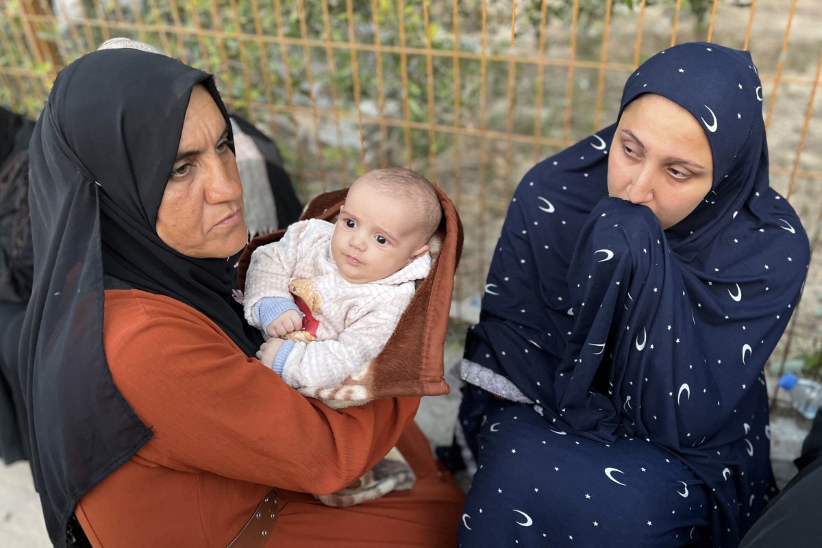 Photo used for representational purposes. Women gather in mourning outside Nasser Medical Complex in Khan Yunis in the southern Gaza Strip on March 30, 2025 as the bodies of Palestinian first responders who were killed a week before in Israeli military fire on ambulances arrive at the facility. Photo by AFP.