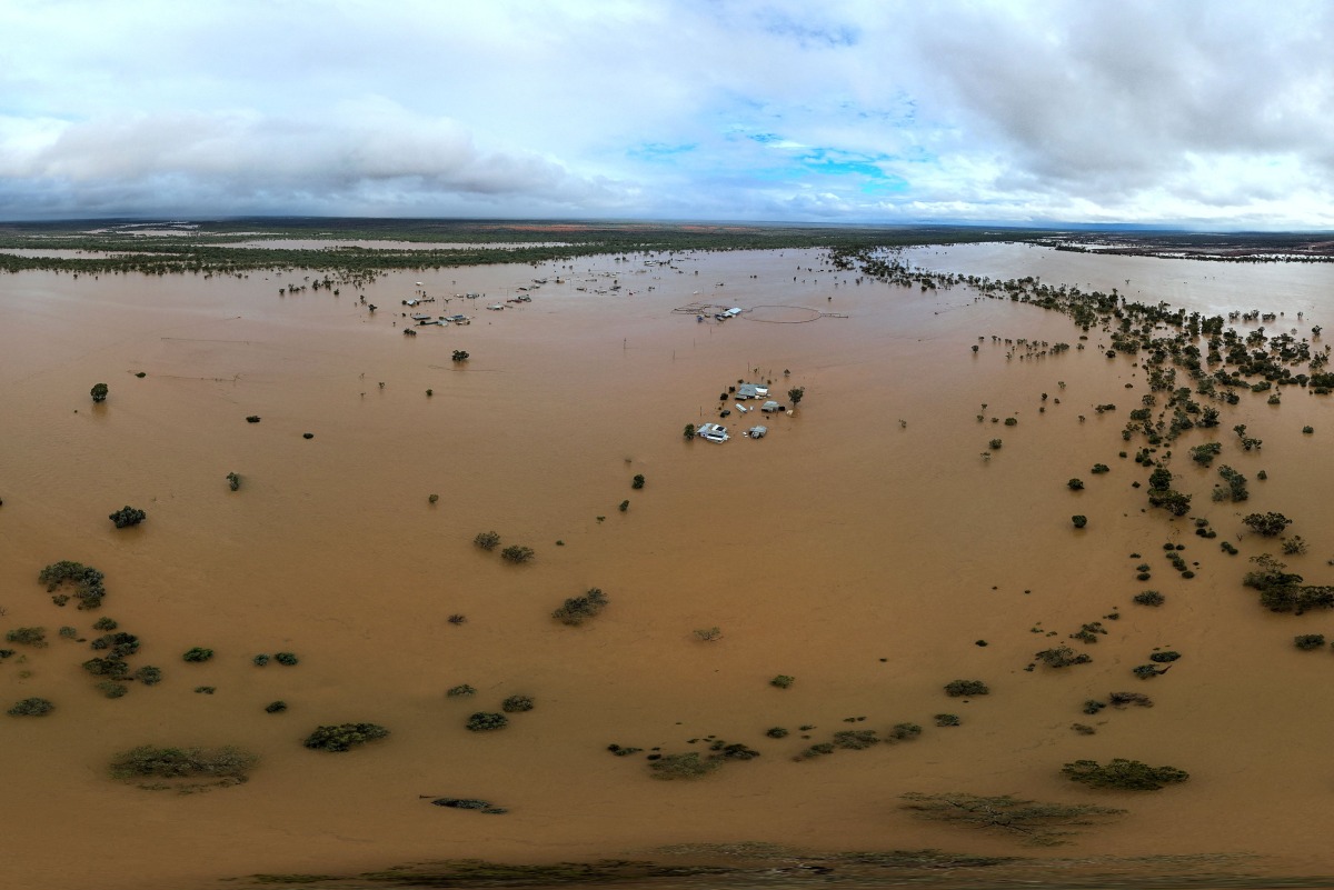 This handout photo taken on March 29, 2025 and released by The Queensland Fire Department shows homes under floodwaters in the town of Windorah in central-west Queensland. Photo by Handout / QUEENSLAND FIRE DEPARTMENT / AFP