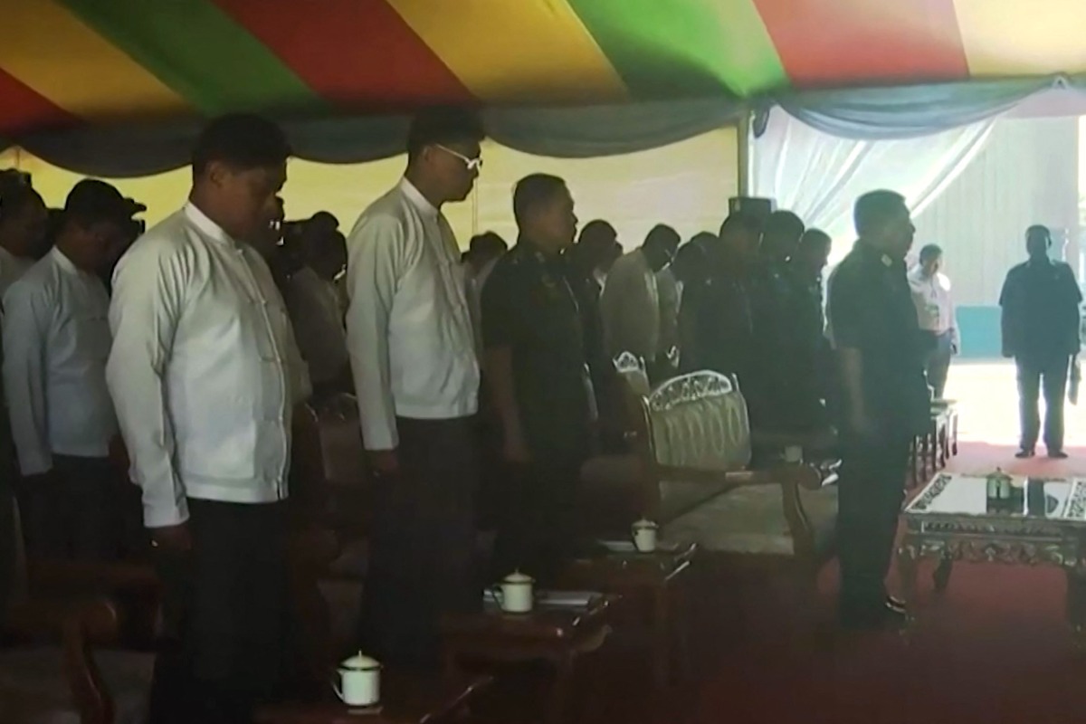 This frame grab taken from state-run Myanmar Radio and Television (MRTV) video footage released on April 1, 2025 shows Myanmar's military chief Min Aung Hlaing (2nd R) with military generals and officials observing a minute of silence for earthquake victims in Naypyidaw. (Photo by Myanmar Radio and Television / AFP)