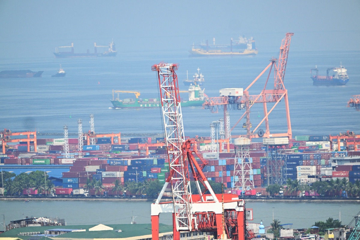 A general view shows containers and cranes at the international port of Manila on April 3, 2025. Photo by Ted ALJIBE / AFP