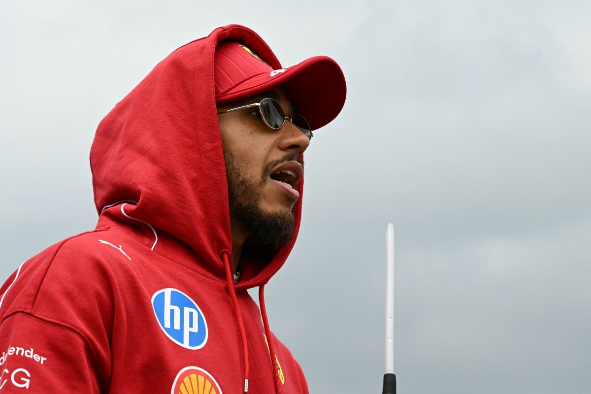 Ferrari's British driver Lewis Hamilton is pictured after the drivers' parade before the start of the Formula One Japanese Grand Prix at the Suzuka circuit in Suzuka, Mie prefecture, Japan on April 6, 2025. (Photo by Toshifumi KITAMURA / AFP)