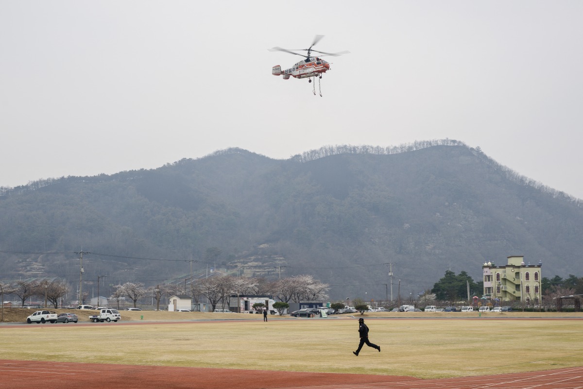 A firefighting KA-32A helicopter operated by Korea's Forest Aviation takes off in Yeongdeok on March 28, 2025, during operations to control wildfires. Photo by ANTHONY WALLACE / AFP