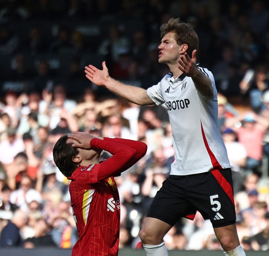 Liverpool’s Federico Chiesa (left) reacts after missing a chance.