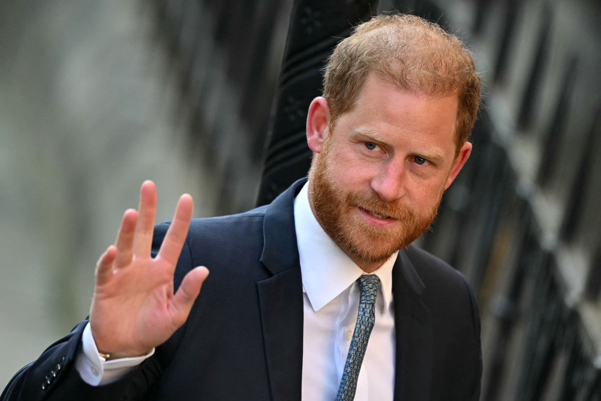 Britain's Prince Harry, Duke of Sussex waves as he arrives at the the Royal Courts of Justice, Britain's High Court, in central London, on April 8, 2025. Photo by JUSTIN TALLIS / AFP