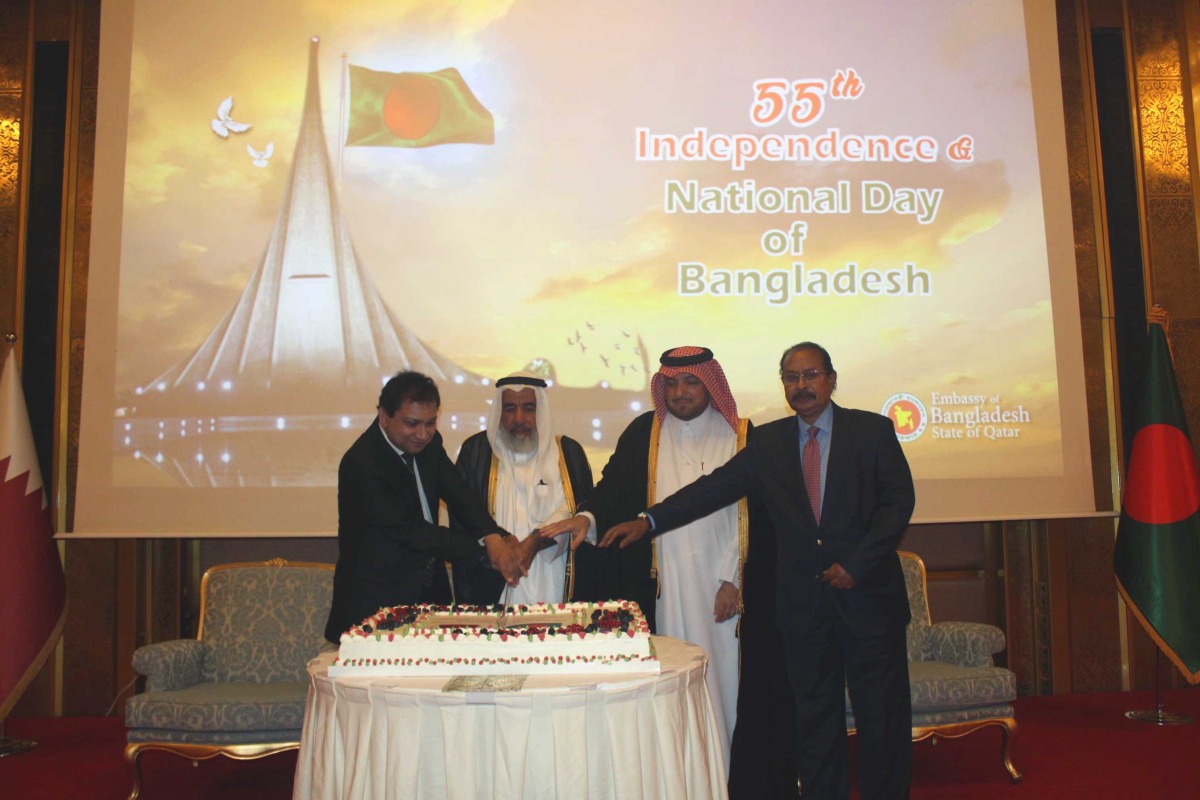 Minister of Awqaf and Islamic Affairs H E Ghanem bin Shaheen bin Ghanem Al Ghanim, Director of the Protocol Department at the Ministry of Foreign Affairs H E Ibrahim Yousif Abdullah Fakhro, Ambassador of Bangladesh to Qatar H E Mohammed Nazrul Islam and Dean of the Diplomatic Corps H E Ali Ibrahim Ahmed cutting a cake to mark 55th Independence and National Day of Bangladesh.