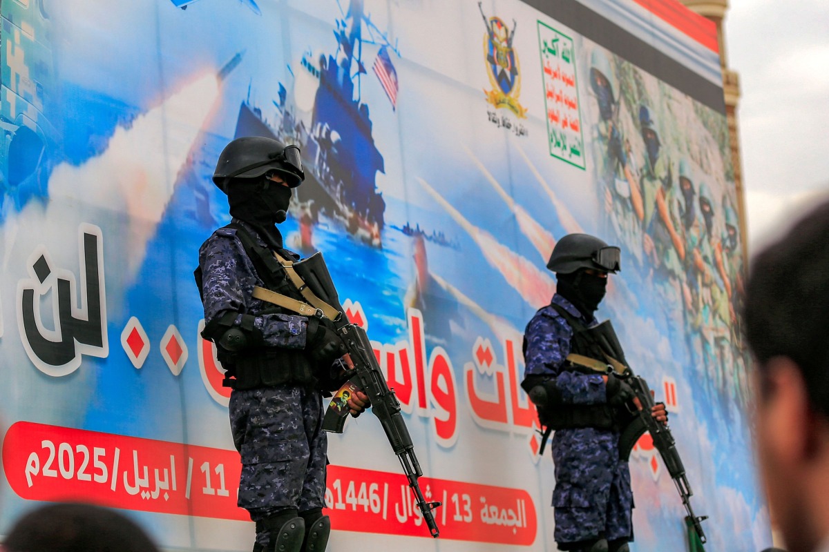 Members of Huthi-affiliated security forces stand guard during a rally in solidarity with Palestinians in the Gaza Strip and in condemnation of US strikes, in Yemen's Huthi-controlled capital Sanaa on April 11, 2025. (Photo by Mohammed HUWAIS / AFP)
