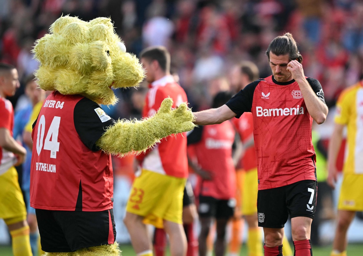 Bayer Leverkusen's German midfielder #07 Jonas Hofmann reacts after the German first division Bundesliga football match between Bayer Leverkusen and Union Berlin in Leverkusen, western Germany, on April 12, 2025. (Photo by INA FASSBENDER / AFP)