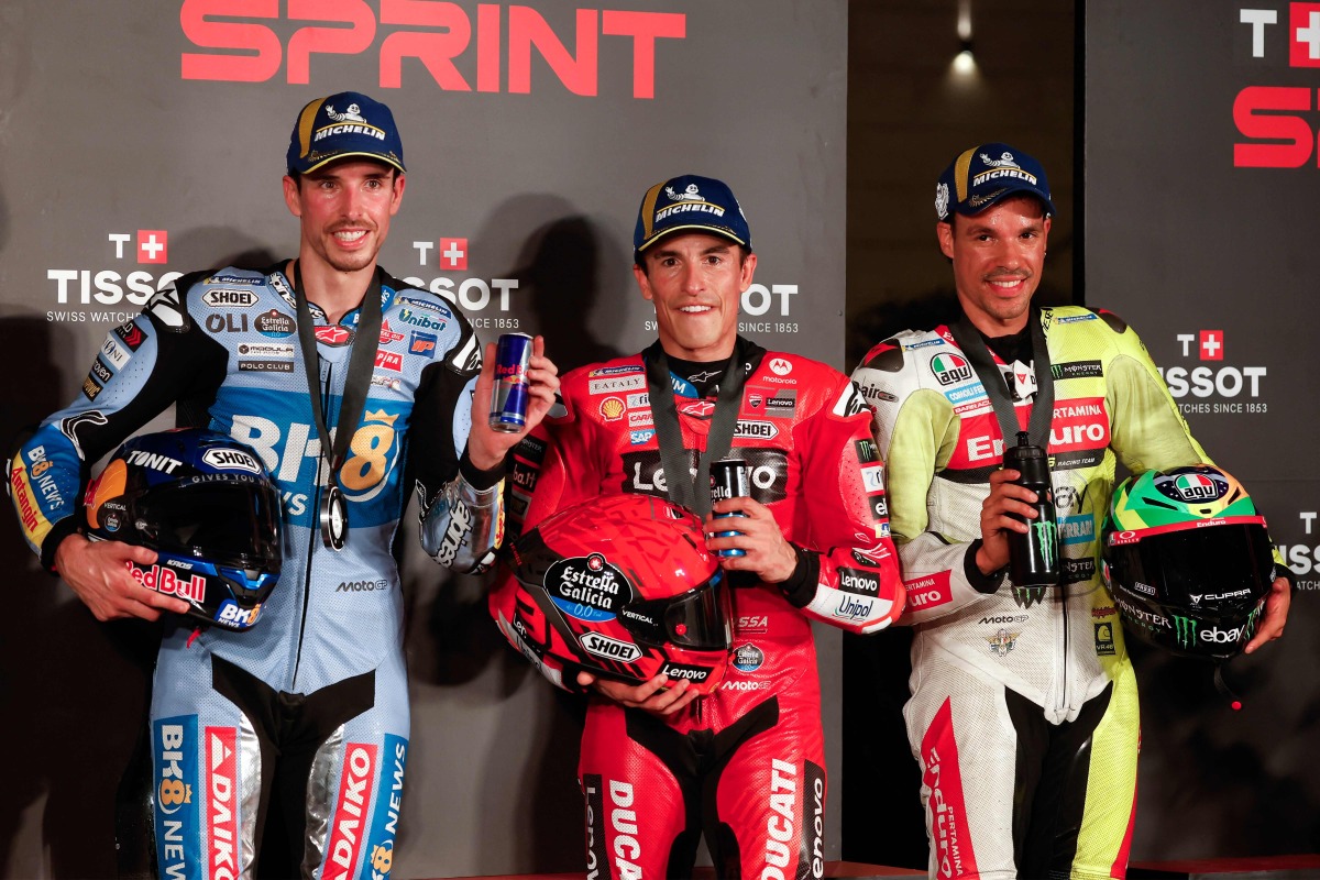 BK8 Gresini Racing MotoGP’s Spanish rider Alex Marquez (left) Ducati Lenovo’s Spanish rider Marc Marquez (centre) and Pertamina Enduro VR46 Racing Team’s Italian rider Franco Morbidelli pose for a picture following the Qatar Moto GP Grand Prix sprint race.