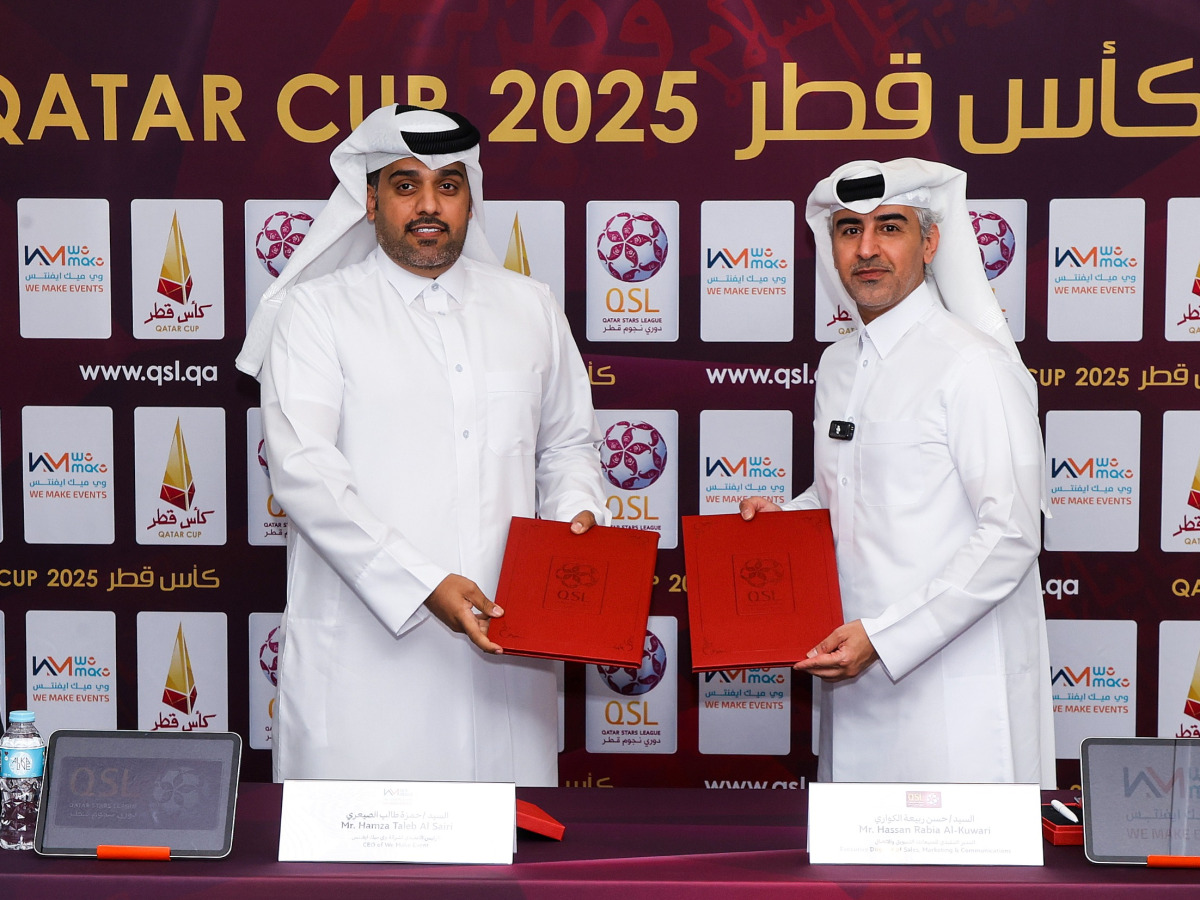 Executive Director of Sales, Marketing and Communication at QSL Hassan Rabiah Al Kuwari (right) and Founder and CEO of We Make Events Hamza Taleb Al Sairi pose for a picture after signing the sponsorship agreement. 