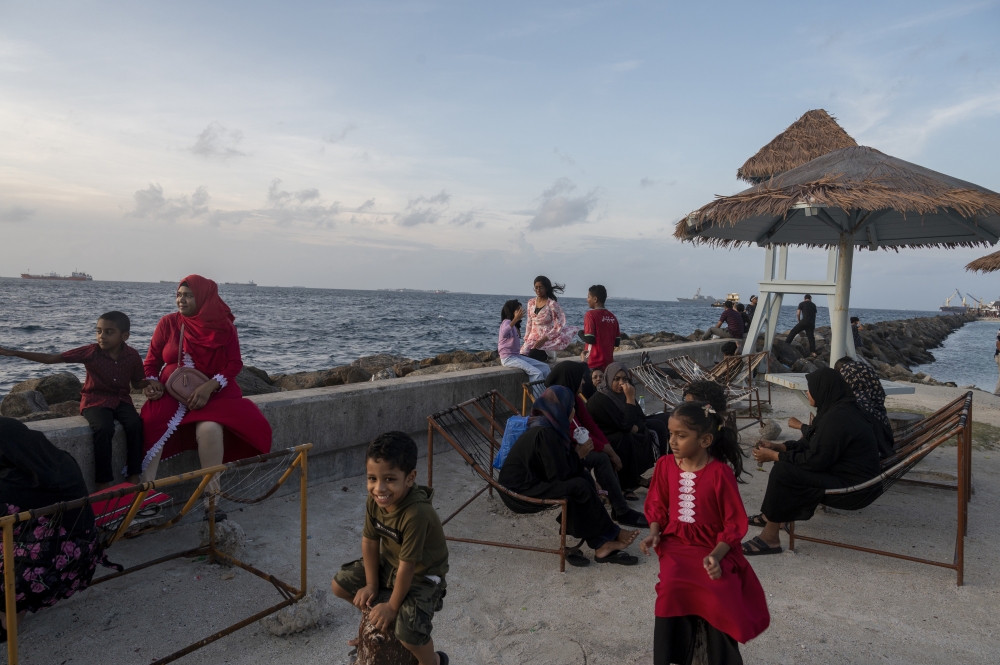 File: People spend time by the ocean in Malé, Maldives. (Photo by Saumya Khandelwal/For The Washington Post)