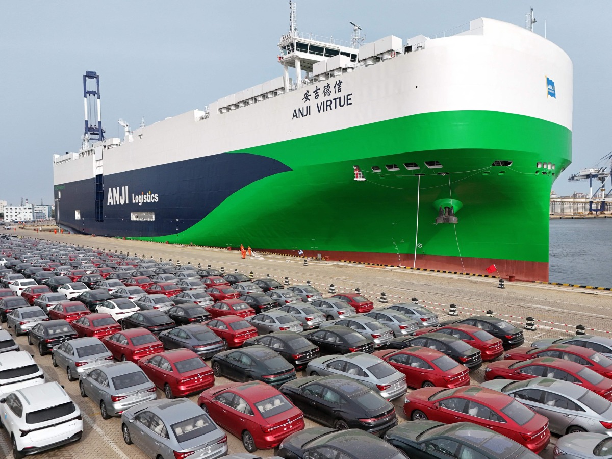 Chinese-made MG cars wait to be loaded onto the newly commissioned and Chinese-built 7,800-car LNG dual-fuel car carrier 