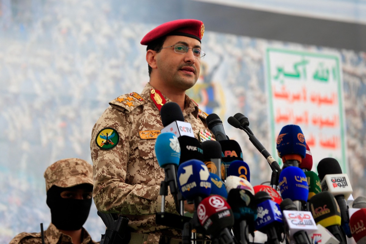 Brigadier Yahya Saree Qasim, the spokesman for Yemen's Houthis, speaks during a protest to denounce US airstrikes on Yemen, in Sanaa on April 18, 2025. (Photo by MOHAMMED HUWAIS / AFP)
