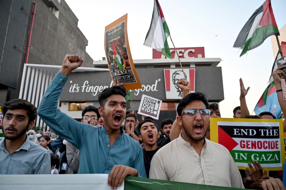 Supporters of Islami Jamiat-e-Talaba (IJT), a student wing of Pakistan's Jamaat-e-Islami (JI) party stage a pro-Palestinian protest outside a Kentucky Fried Chicken (KFC) restaurant on May 7, 2024. (Photo by Farooq Naeem / AFP)
