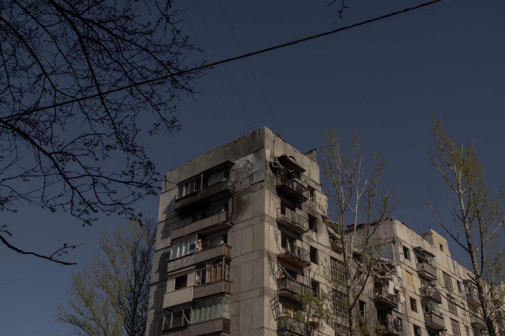 This photograph shows a residential building, heavily damaged by air attacks in Kostyantynivka, in the eastern Donetsk region, on April 20, 2025. (Photo by Roman Pilipey / AFP)
