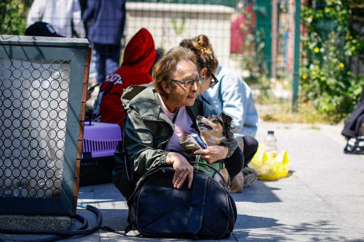 Local residents wait in a street in Istanbul on April 23, 2025, following an initial quake at 12:49 pm (0949 GMT) followed by three others of with magnitudes of 4.4 to 4.9. Photo by KEMAL ASLAN / AFP