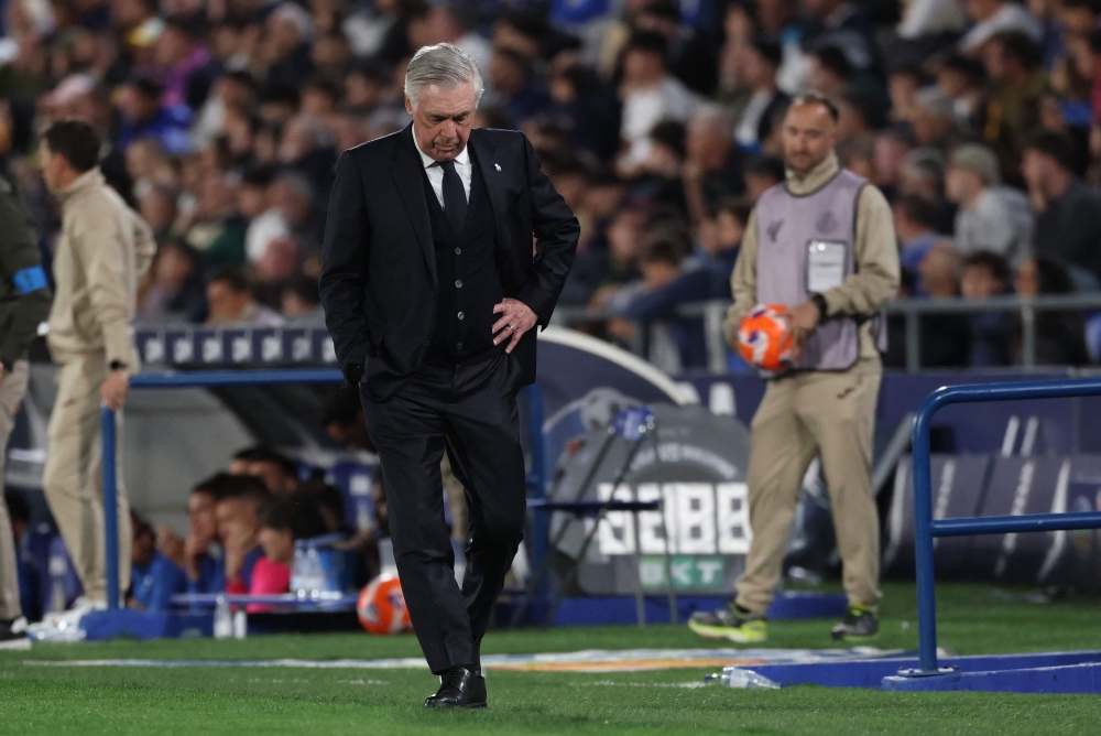 Real Madrid's Italian coach Carlo Ancelotti reacts during the Spanish league football match between Getafe CF and Real Madrid CF at the Coliseum Alfonso Perez stadium in Getafe, on April 23, 2025. (Photo by Thomas Coex / AFP)