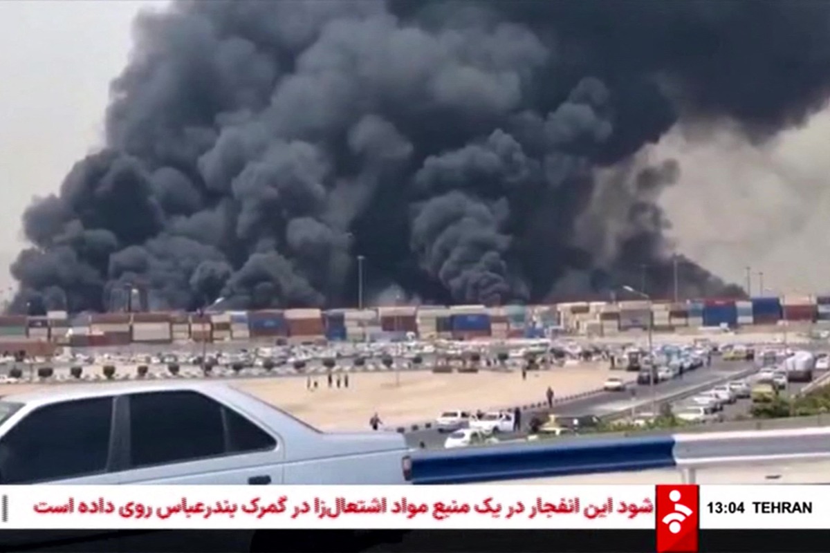 This image grab taken from footage released by the state television Islamic Republic of Iran Broadcasting News (IRIBNEWS) on April 26, 2025 shows thick black smoke billowing following an explosion at the Shahid Rajaee port dock southwest of Bandar Abbas in the Iranian province of Hormozgan. Photo by IRIBNEWS / AFP.