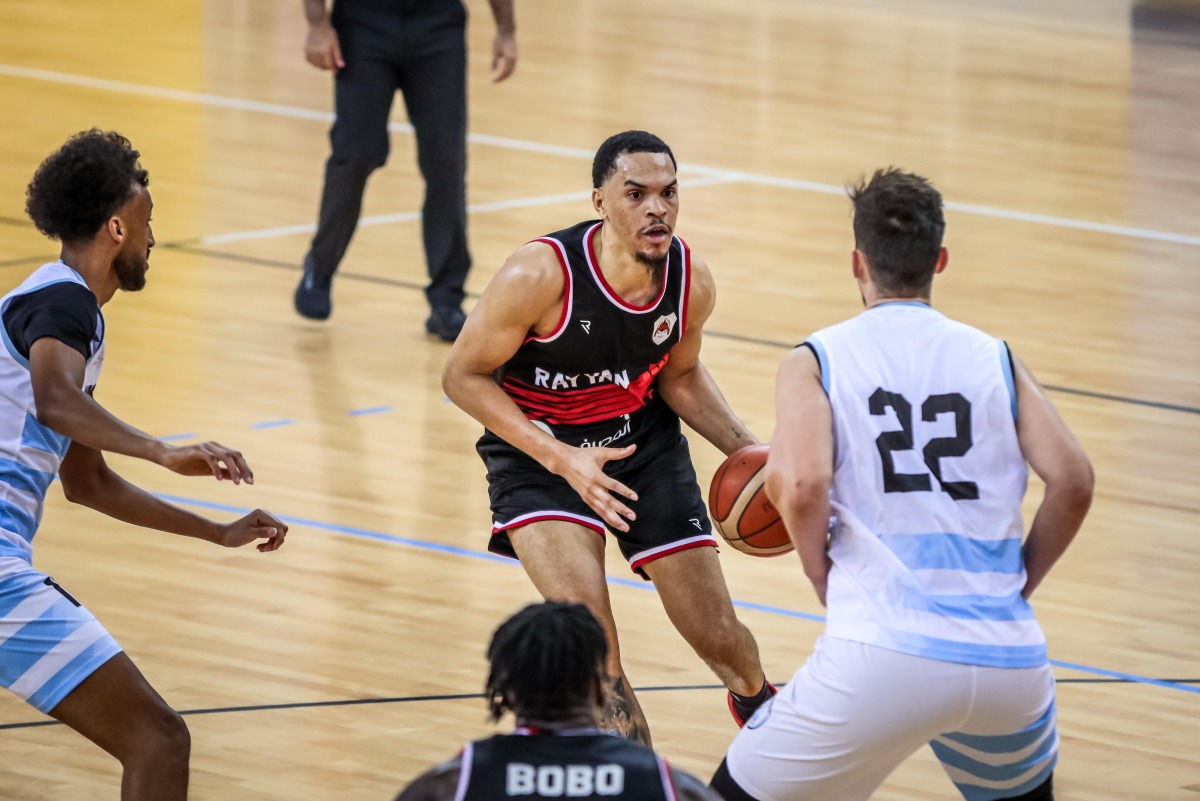 Al Rayya's Tyler James Lee Harris (left) attempts to dribble past an Al Wakrah player.