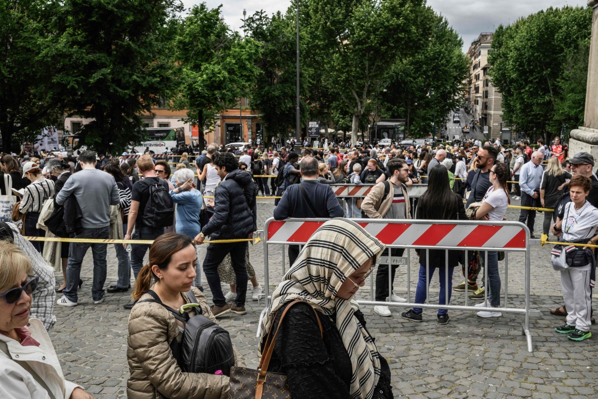 People queue to visit Santa Maria Maggiore Basilica hosting the tomb of Pope Francis, on the first day of its opening to the public, in Rome on April 27, 2025. Photo by JEFF PACHOUD / AFP