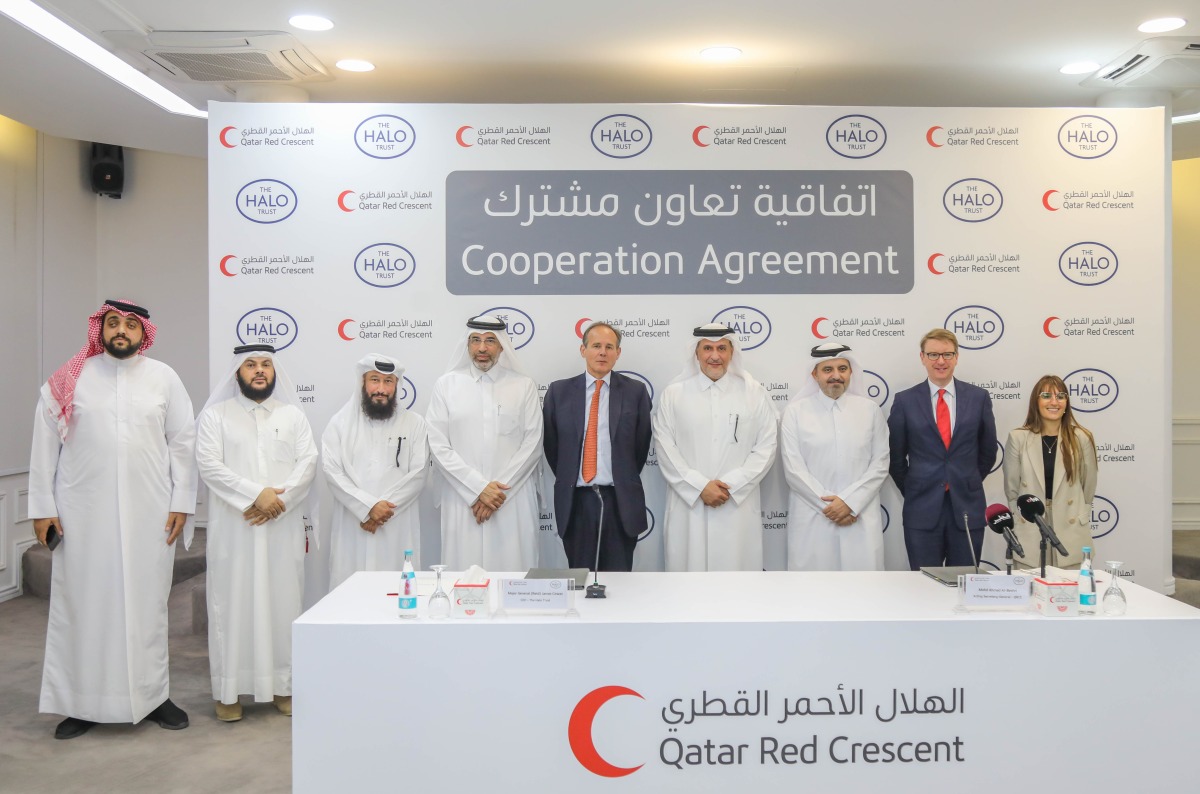 Representatives from the two entities at the agreement signing.